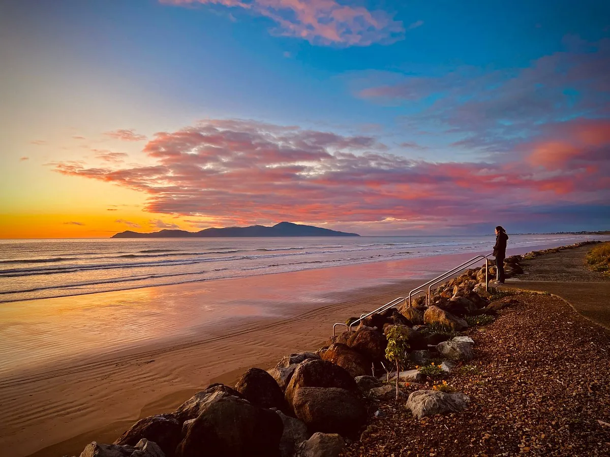 Warm sunset over the sea and beach on the Kāpiti Coast